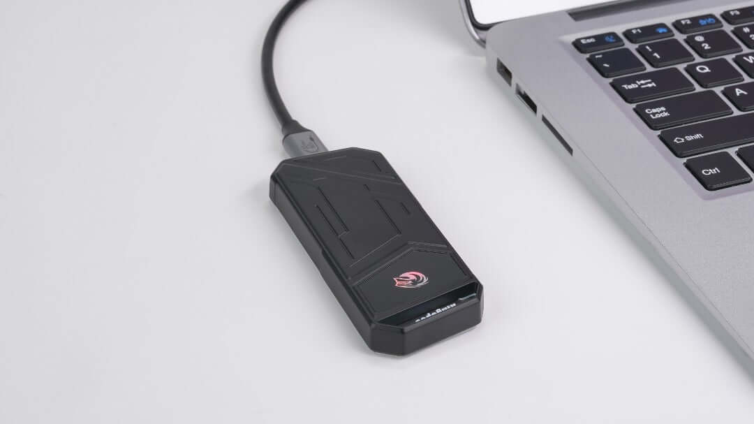 UTZYx Super Fast External Portable SSD connected to a laptop, showcasing sleek design and advanced performance features.